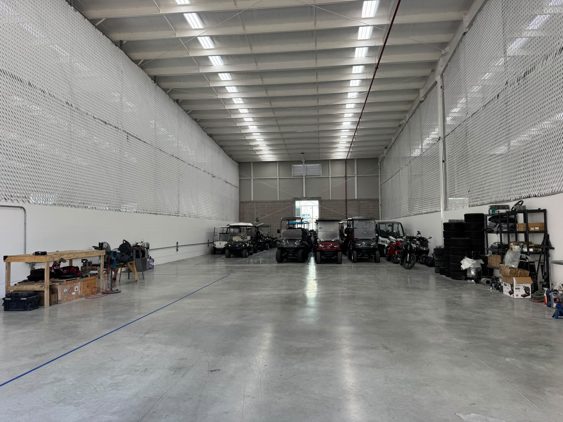 Inside the Zycar Baja workshop with golf carts in for service